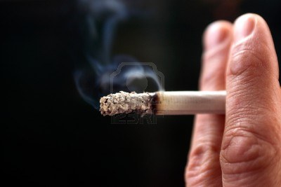 13163899-a-close-up-of-fingers-holding-a-cigarette